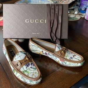 Gucci leather canvas loafers.